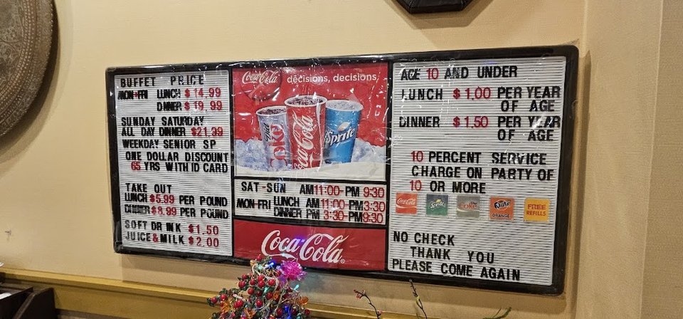 Menu board beside the buffet counter.